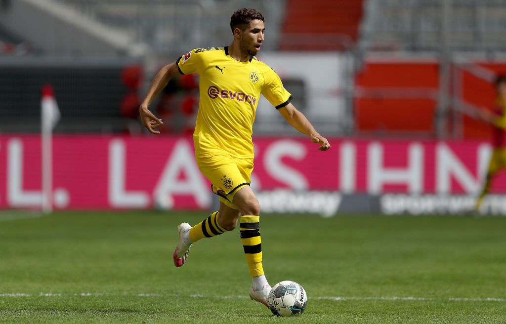 DUESSELDORF, GERMANY - JUNE 13: Achraf Hakimi of Dortmund runs with the ball during the Bundesliga match between Fortuna Duesseldorf and Borussia Dortmund at Merkur Spiel-Arena on June 13, 2020 in Duesseldorf, Germany. (Photo by Lars Baron/Getty Images)