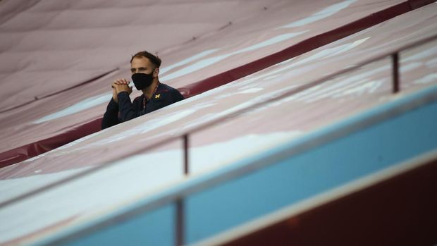 BIRMINGHAM, ENGLAND - JUNE 17: A member of the backroom staff is seen sitting in the stands wearing a face mask during the Premier League match between Aston Villa and Sheffield United at Villa Park on June 17, 2020 in Birmingham, England. (Photo by Carl Recine/Pool via Getty Images)