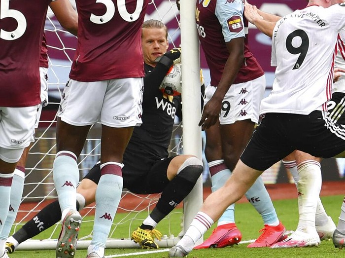 Aston Villas Oerjan Nyland saves inside the net during the English Premier League soccer match between Aston Villa and Sheffield United at Villa Park in Birmingham, England, Wednesday, June 17, 2020. The English Premier League resumes Wednesday after its three-month suspension because of the coronavirus outbreak. (Paul Ellis/Pool via AP)
