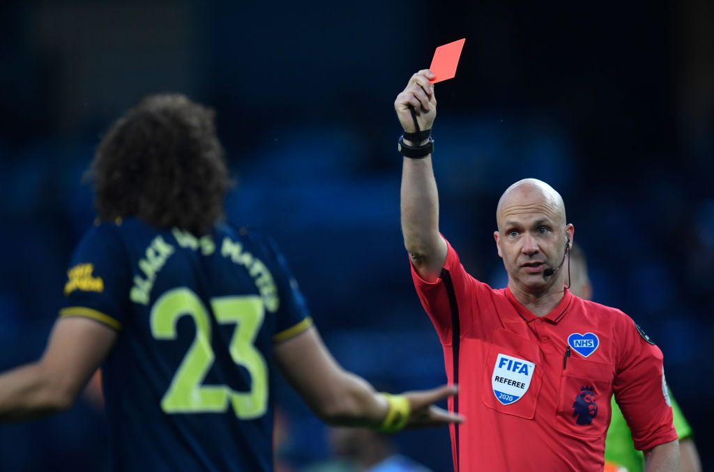 MANCHESTER, ENGLAND - JUNE 17: David Luiz of Arsenal walks along the touchline after being sent off during the Premier League match between Manchester City and Arsenal FC at Etihad Stadium on June 17, 2020 in Manchester, United Kingdom. (Photo by Laurence Griffiths/Getty Images)