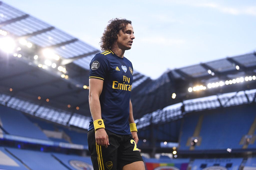 Arsenal's David Luiz leaves the field after getting a red card during the English Premier League soccer match between Manchester City and Arsenal at the Etihad Stadium in Manchester, England, Wednesday, June 17, 2020. The English Premier League resumes Wednesday after its three-month suspension because of the coronavirus outbreak. (Laurence Griffiths/Pool via AP)