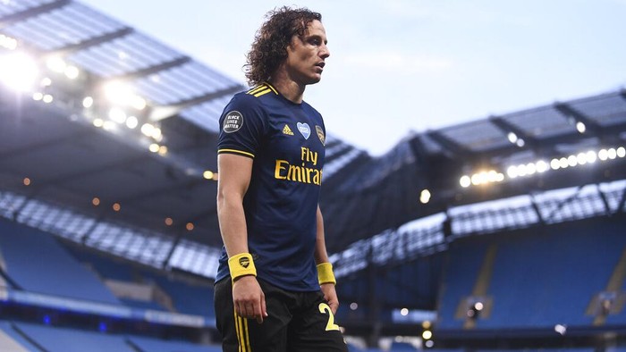 Arsenals David Luiz leaves the field after getting a red card during the English Premier League soccer match between Manchester City and Arsenal at the Etihad Stadium in Manchester, England, Wednesday, June 17, 2020. The English Premier League resumes Wednesday after its three-month suspension because of the coronavirus outbreak. (Laurence Griffiths/Pool via AP)