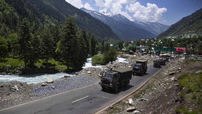 An Indian army convoy moves on the Srinagar- Ladakh highway at Gagangeer, north-east of Srinagar, India, Wednesday, June 17, 2020. Indian security forces said neither side fired any shots in the clash in the Ladakh region late Monday that was the first deadly confrontation on the disputed border between India and China since 1975. China said Wednesday that it is seeking a peaceful resolution to its Himalayan border dispute with India following the death of 20 Indian soldiers in the most violent confrontation in decades. (AP Photo/Mukhtar Khan)