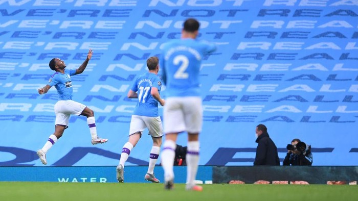 MANCHESTER, ENGLAND - JUNE 17: Raheem Sterling of Manchester City celebrates after scoring his sides first goal during the Premier League match between Manchester City and Arsenal FC at Etihad Stadium on June 17, 2020 in Manchester, United Kingdom. (Photo by Laurence Griffiths/Getty Images)
