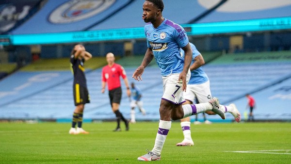 MANCHESTER, ENGLAND - JUNE 17: Raheem Sterling of Manchester City celebrates after scoring his teams first goal during the Premier League match between Manchester City and Arsenal FC at Etihad Stadium on June 17, 2020 in Manchester, United Kingdom. (Photo by Dave Thompson/ Pool via Getty Images)