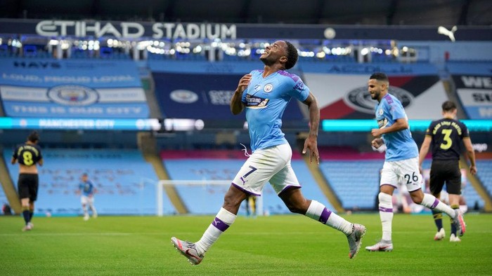 MANCHESTER, ENGLAND - JUNE 17: Raheem Sterling of Manchester City celebrates after scoring his teams first goal during the Premier League match between Manchester City and Arsenal FC at Etihad Stadium on June 17, 2020 in Manchester, United Kingdom. (Photo by Dave Thompson/ Pool via Getty Images)