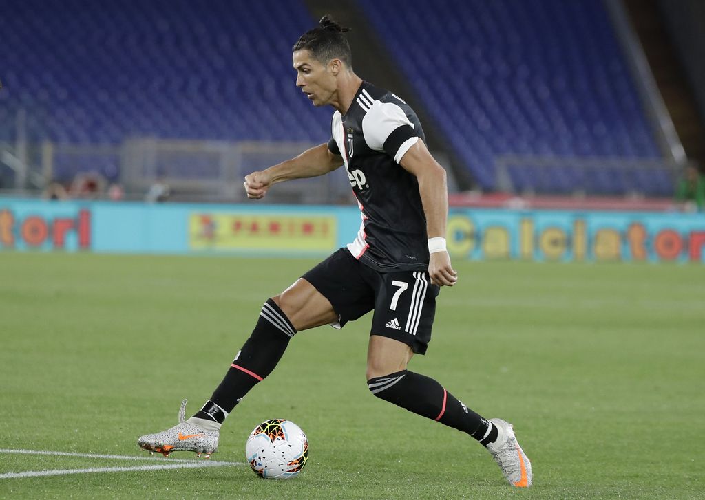 Juventus' Cristiano Ronaldo controls the ball during the Italian Cup soccer final match between Napoli and Juventus, at Rome's Olympic Stadium, Wednesday, June 17, 2020. (AP Photo/Andrew Medichini)