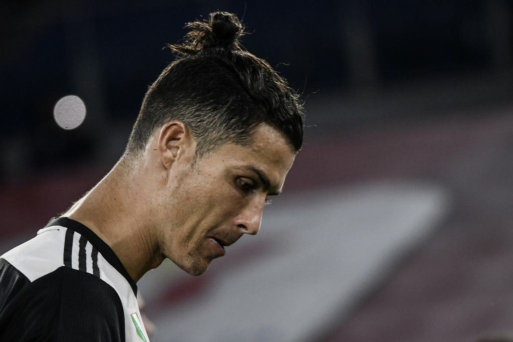 Juventus' Portuguese forward Cristiano Ronaldo reacts after Juventus lost the TIM Italian Cup (Coppa Italia) final football match Napoli vs Juventus on June 17, 2020 at the Olympic stadium in Rome, played behind closed doors as the country gradually eases the lockdown aimed at curbing the spread of the COVID-19 infection, caused by the novel coronavirus. (Photo by Filippo MONTEFORTE / AFP)