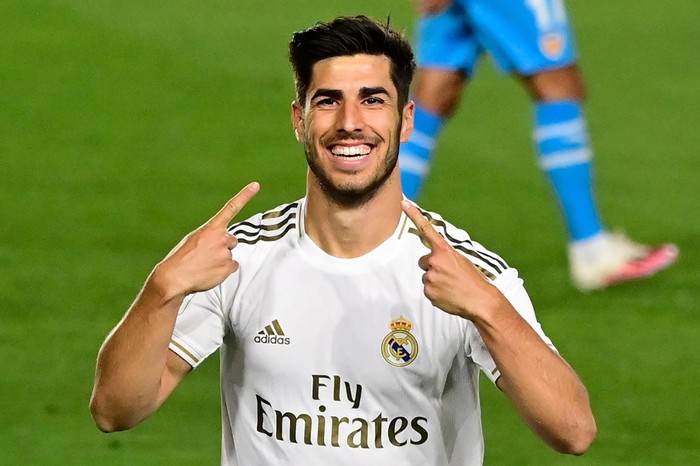 Real Madrids Spanish midfielder Marco Asensio celebrates his goal during the Spanish league football match between Real Madrid CF and Valencia CF at the Alfredo di Stefano stadium in Valdebebas, on the outskirts of Madrid, on June 18, 2020. (Photo by JAVIER SORIANO / AFP)