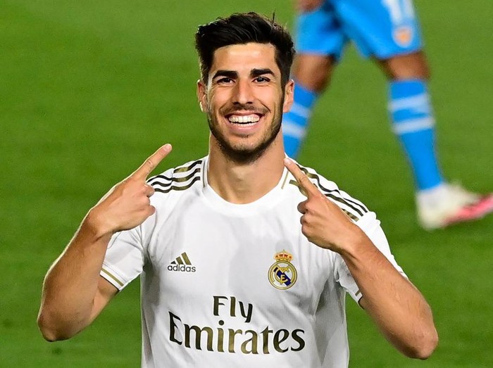 Real Madrids Spanish midfielder Marco Asensio celebrates his goal during the Spanish league football match between Real Madrid CF and Valencia CF at the Alfredo di Stefano stadium in Valdebebas, on the outskirts of Madrid, on June 18, 2020. (Photo by JAVIER SORIANO / AFP)