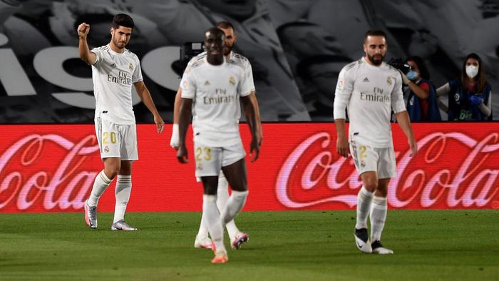 Real Madrid MADRID, SPAIN - JUNE 18: Marco Asensio of Real Madrid CF celebrates scoring his teams second goal during the Liga match between Real Madrid CF and Valencia CF at Estadio Alfredo Di Stefano on June 18, 2020 in Madrid, Spain. (Photo by Denis Doyle/Getty Images)