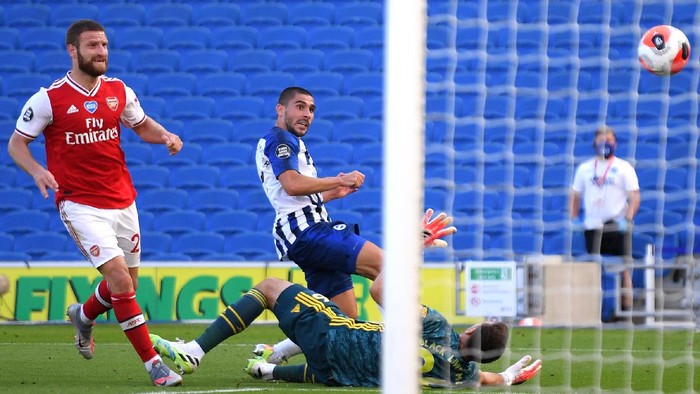 BRIGHTON, ENGLAND - JUNE 20: Neal Maupay of Brighton and Hove Albion scores his teams second goal past Emiliano Martinez of Arsenal during the Premier League match between Brighton & Hove Albion and Arsenal FC at American Express Community Stadium on June 20, 2020 in Brighton, England. Football Stadiums around Europe remain empty due to the Coronavirus Pandemic as Government social distancing laws prohibit fans inside venues resulting in all fixtures being played behind closed doors. (Photo by Mike Hewitt/Getty Images)