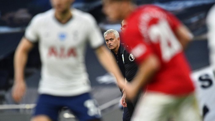 Tottenhams manager Jose Mourinho watches play during the English Premier League soccer match between Tottenham Hotspur and Manchester United at Tottenham Hotspur Stadium in London, England, Friday, June 19, 2020. (AP Photo/Glyn Kirk, Pool)