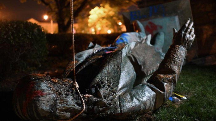The statue of Confederate general Albert Pike is pictured after it was toppled by protesters at Judiciary square in Wahsington, DC on late June 19, 2020. - Protesters have toppled the only statue of a Confederate general in the US capital, images broadcast by US media show.
President Donald Trump tweeted that the Washington