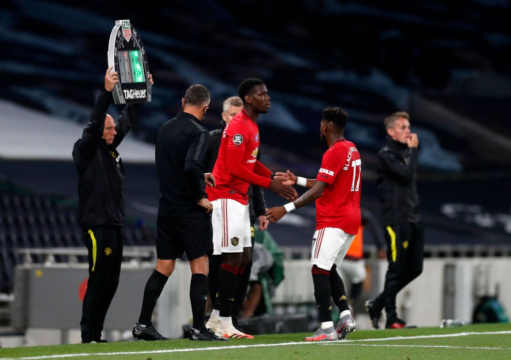 LONDON, ENGLAND - JUNE 19: Paul Pogba of Manchester United is challenged by Eric Dier of Tottenham Hotspur during the Premier League match between Tottenham Hotspur and Manchester United at Tottenham Hotspur Stadium on June 19, 2020 in London, England. (Photo by Shaun Botterill/Getty Images)