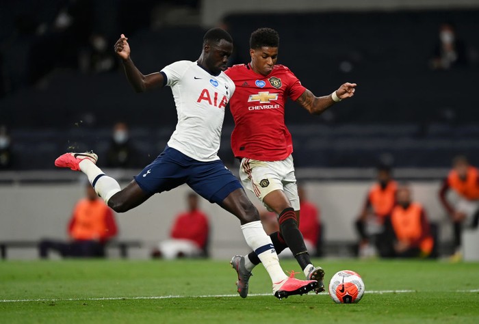 LONDON, ENGLAND - JUNE 19: Marcus Rashford of Manchester United is tackled by Davinson Sanchez of Tottenham Hotspur  during the Premier League match between Tottenham Hotspur and Manchester United at Tottenham Hotspur Stadium on June 19, 2020 in London, England. (Photo by Shaun Botterill/Getty Images)