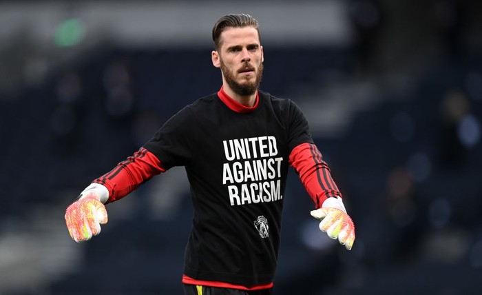 LONDON, ENGLAND - JUNE 19: David De Gea of Manchester United warms up while wearing a United Against Racism t-shirt prior to the Premier League match between Tottenham Hotspur and Manchester United at Tottenham Hotspur Stadium on June 19, 2020 in London, England. (Photo by Shaun Botterill/Getty Images)