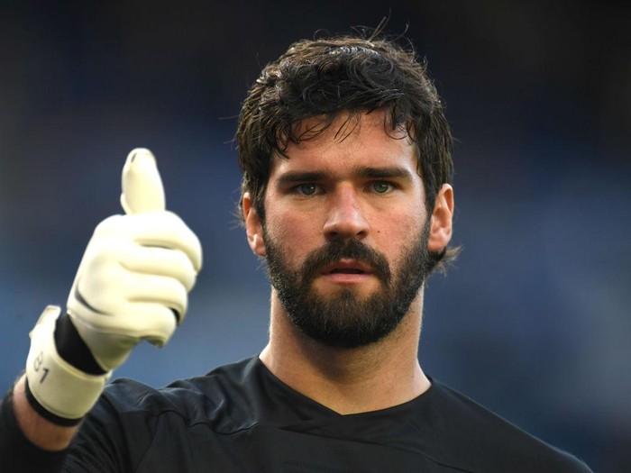 LIVERPOOL, ENGLAND - JUNE 21: Alisson Becker of Liverpool shows a thumbs up while the logo in support of the NHS is seen on his shirt during the Premier League match between Everton FC and Liverpool FC at Goodison Park on June 21, 2020 in Liverpool, England. Football Stadiums around Europe remain empty due to the Coronavirus Pandemic as Government social distancing laws prohibit fans inside venues resulting in all fixtures being played behind closed doors. (Photo by Peter Powell/Pool via Getty Images)