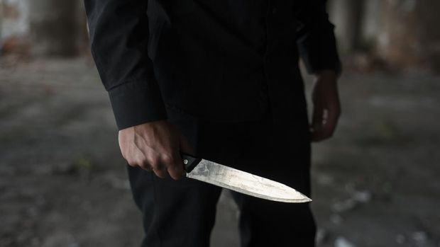 man holding knife in his hand