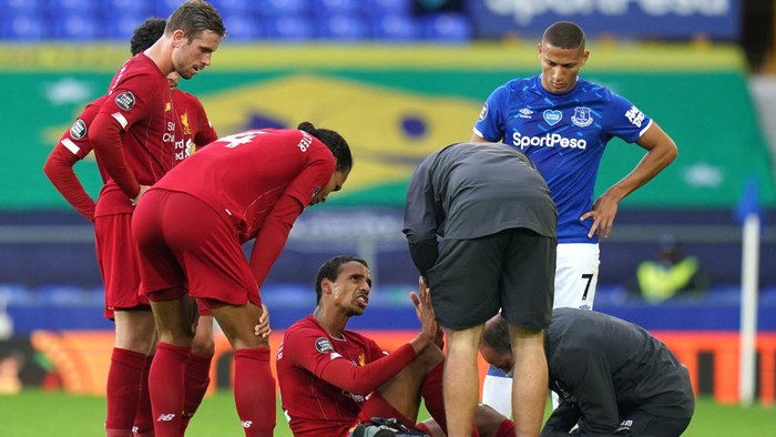 Liverpools James Milner gets injured during the English Premier League soccer match between Everton and Liverpool at Goodison Park in Liverpool, England, Sunday, June 21, 2020. (AP photo/Jon Super, Pool)