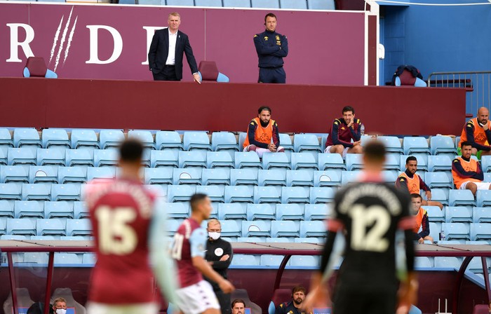 BIRMINGHAM, ENGLAND - JUNE 21: Dean Smith, Manager of Aston Villa and Assistant Head Coach John Terry are seen in the stands during the Premier League match between Aston Villa and Chelsea FC at Villa Park on June 21, 2020 in Birmingham, England. Football Stadiums around Europe remain empty due to the Coronavirus Pandemic as Government social distancing laws prohibit fans inside venues resulting in all fixtures being played behind closed doors. (Photo by Justin Tallis/Pool via Getty Images)