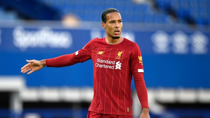 LIVERPOOL, ENGLAND - JUNE 21: Virgil van Dijk of Liverpool looks on during the Premier League match between Everton FC and Liverpool FC at Goodison Park on June 21, 2020 in Liverpool, England. Football Stadiums around Europe remain empty due to the Coronavirus Pandemic as Government social distancing laws prohibit fans inside venues resulting in all fixtures being played behind closed doors. (Photo by Peter Powell/Pool via Getty Images)