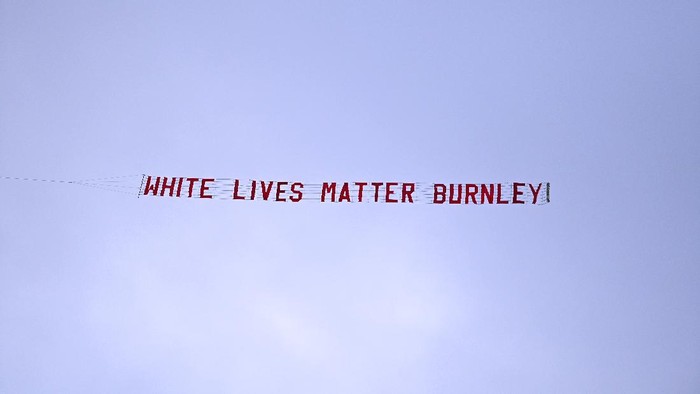 MANCHESTER, ENGLAND - JUNE 22: A plane flies over the stadium with a banner reading White Lives Matter Burnley  during the Premier League match between Manchester City and Burnley FC at Etihad Stadium on June 22, 2020 in Manchester, England. Football stadiums around Europe remain empty due to the Coronavirus Pandemic as Government social distancing laws prohibit fans inside venus resulting in all fixtures being played behind closed doors. (Photo by Shaun Botterill/Getty Images)