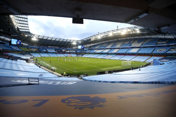 MANCHESTER, ENGLAND - JUNE 22: General view inside the stadium showing the empty seat coverings during the Premier League match between Manchester City and Burnley FC at Etihad Stadium on June 22, 2020 in Manchester, England. Football stadiums around Europe remain empty due to the Coronavirus Pandemic as Government social distancing laws prohibit fans inside venues resulting in all fixtures being played behind closed doors. (Photo by Martin Rickett/Pool via Getty Images)