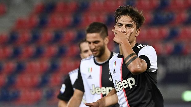 Juventus' Paulo Dybala celebrates scoring during the Serie A soccer match between Bologna FC and Juventus FC at Stadio Renato Dall'Ara stadium in Bologna, Monday June 22, 2020. (Massimo Paolone/LaPresse via AP)