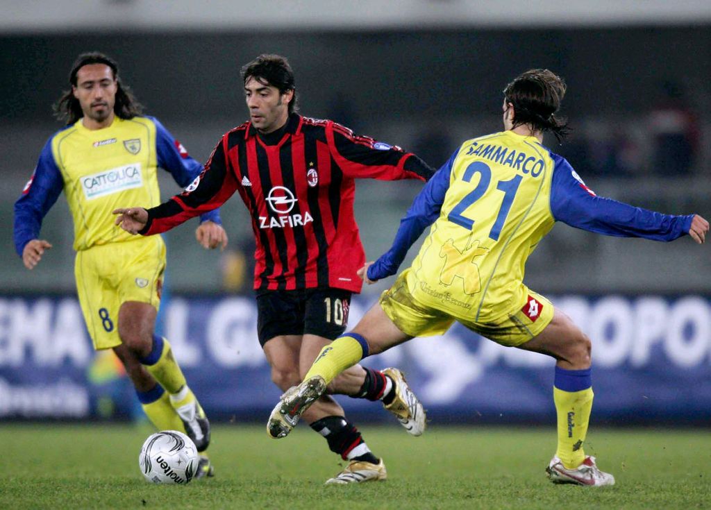 VERONA, ITALY - DECEMBER 3:  Manuel Rui Costa of Milan passes Paolo Sammarco of Chievo during the Serie A match between Chievo and AC Milan at the Marcantonio Bentegodi stadium on December 3, 2005 in Verona, Italy. (Photo by New Press/Getty Images)