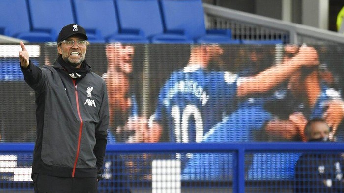 Liverpools manager Jurgen Klopp shouts during the English Premier League soccer match between Everton and Liverpool at Goodison Park in Liverpool, England, Sunday, June 21, 2020. (Peter Powell/Pool via AP)