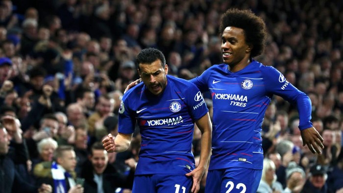 LONDON, ENGLAND - JANUARY 12:  Pedro of Chelsea celebrates with teammate Willian after scoring his teams first goal  during the Premier League match between Chelsea FC and Newcastle United at Stamford Bridge on January 12, 2019 in London, United Kingdom.  (Photo by Clive Rose/Getty Images)