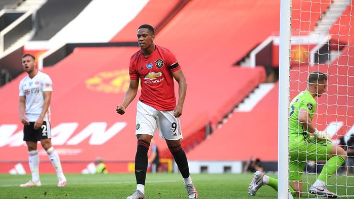 Anthony Martial MANCHESTER, ENGLAND - JUNE 24: Anthony Martial of Manchester United celebrates after scoring his teams first goal during the Premier League match between Manchester United and Sheffield United at Old Trafford on June 24, 2020 in Manchester, England. (Photo by Michael Regan/Getty Images)