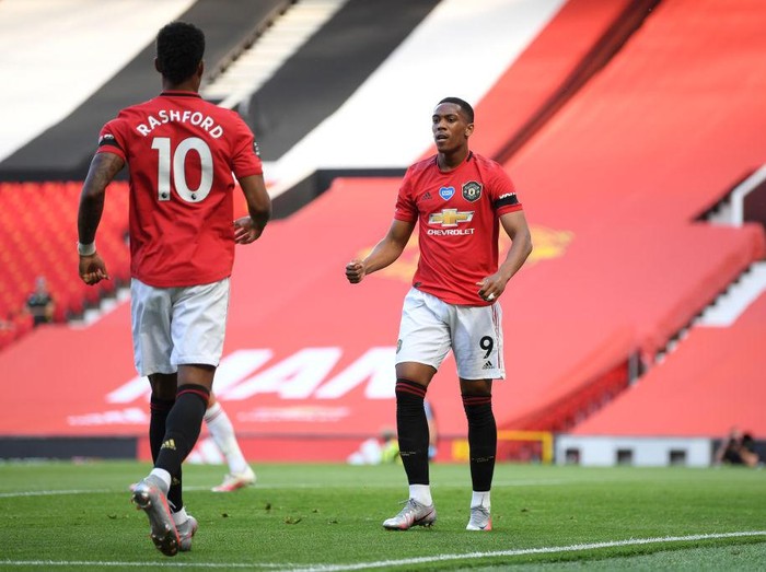 MANCHESTER, ENGLAND - JUNE 24: Anthony Martial of Manchester United celebrates with Marcus Rashford after scoring his teams first goal during the Premier League match between Manchester United and Sheffield United at Old Trafford on June 24, 2020 in Manchester, England. (Photo by Michael Regan/Getty Images)