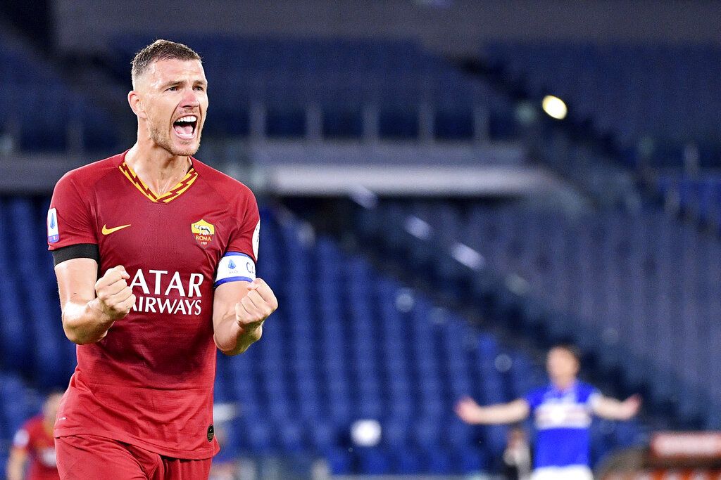 Roma's Edin Dzeko celebrates after scoring a goal during a Serie A soccer match between Roma and Sampdoria at Olimpico Stadium in Rome Wednesday, June 24, 2020. (Alfredo Falcone/LaPresse via AP)