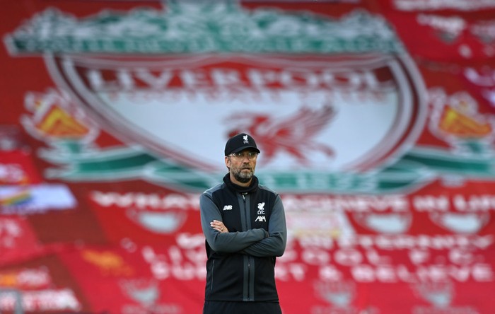 LIVERPOOL, ENGLAND - JUNE 24: Jurgen Klopp, Manager of Liverpool looks on as his team warm up ahead of the Premier League match between Liverpool FC and Crystal Palace at Anfield on June 24, 2020 in Liverpool, England. (Photo by Shaun Botterill/Getty Images)