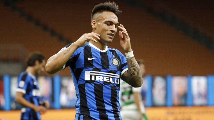 Inter Milans Lautaro Martinez reacts after missing a scoring chance during the Serie A soccer match between Inter Milan and Sassuolo at the San Siro Stadium, in Milan, Italy, Wednesday, June 24, 2020. (AP Photo/Luca Bruno)