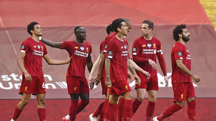 Liverpool FC Liverpools Trent Alexander-Arnold, left, celebrates after scoring the opening goal during the English Premier League soccer match between Liverpool and Crystal Palace at Anfield Stadium in Liverpool, England, Wednesday, June 24, 2020. (Paul Ellis/Pool via AP)