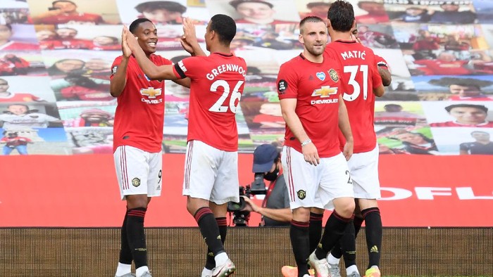 MANCHESTER, ENGLAND - JUNE 24: Anthony Martial of Manchester United celebrates with Mason Greenwood after scoring his teams third goal during the Premier League match between Manchester United and Sheffield United at Old Trafford on June 24, 2020 in Manchester, England. (Photo by Michael Regan/Getty Images)