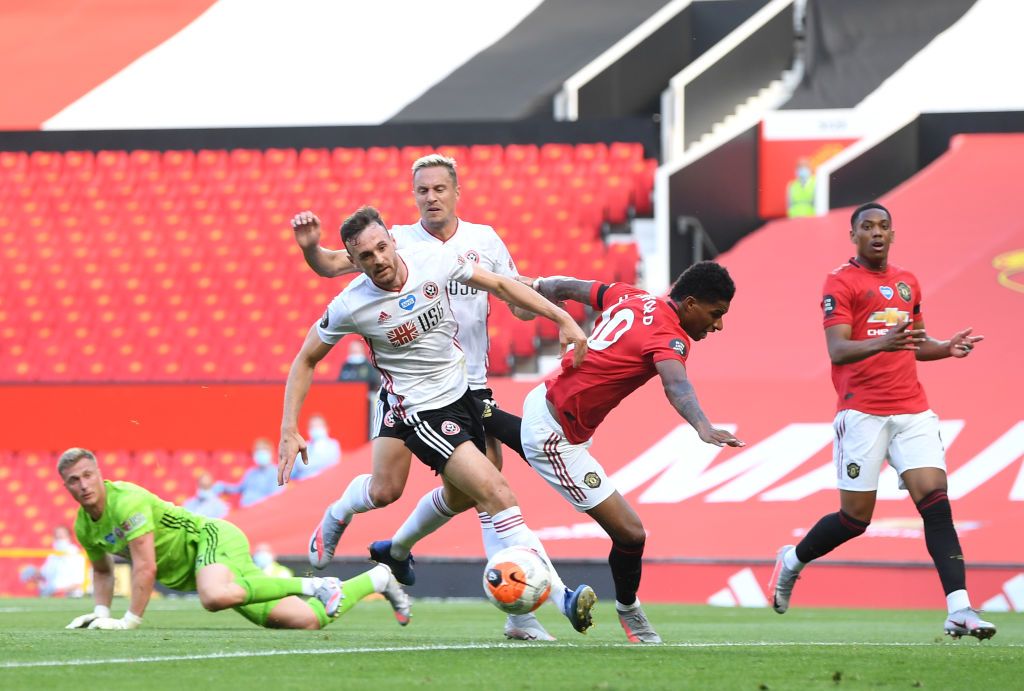 MANCHESTER, ENGLAND - JUNE 24: Anthony Martial of Manchester United celebrates with Marcus Rashford after scoring his team's first goal during the Premier League match between Manchester United and Sheffield United at Old Trafford on June 24, 2020 in Manchester, England. (Photo by Michael Regan/Getty Images)