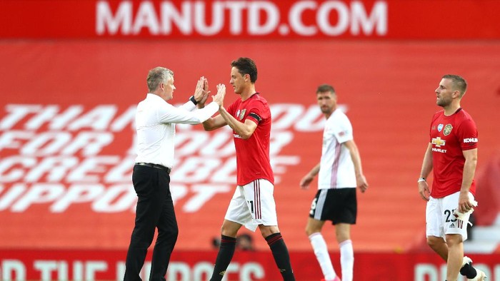 MANCHESTER, ENGLAND - JUNE 24: Ole Gunnar Solskjaer, Manager of anchester United  interacts with Nemanja Matic after the Premier League match between Manchester United and Sheffield United at Old Trafford on June 24, 2020 in Manchester, England. (Photo by Michael Steele/Getty Images)