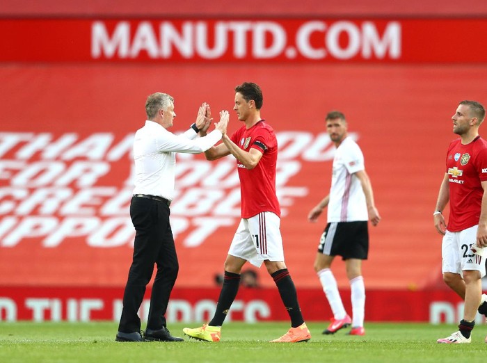 MANCHESTER, ENGLAND - JUNE 24: Ole Gunnar Solskjaer, Manager of anchester United  interacts with Nemanja Matic after the Premier League match between Manchester United and Sheffield United at Old Trafford on June 24, 2020 in Manchester, England. (Photo by Michael Steele/Getty Images)