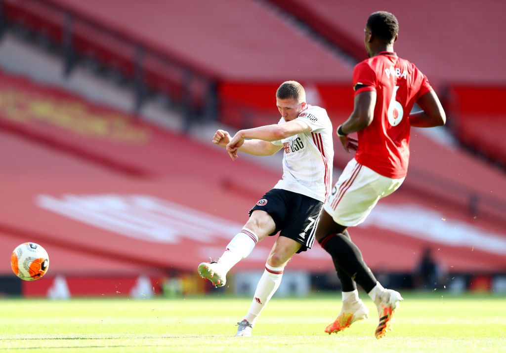 MANCHESTER, ENGLAND - JUNE 24: Anthony Martial of Manchester United celebrates with Marcus Rashford after scoring his team's first goal during the Premier League match between Manchester United and Sheffield United at Old Trafford on June 24, 2020 in Manchester, England. (Photo by Michael Regan/Getty Images)