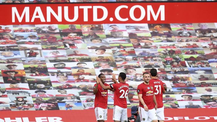 Manchester United Manchester Uniteds Anthony Martial, left, celebrates with his teammates, after scoring his sides third goal during the English Premier League soccer match between Manchester United and Sheffield United at Old Trafford in Manchester, England, Wednesday, June 24, 2020. (Michael Regan/Pool via AP)