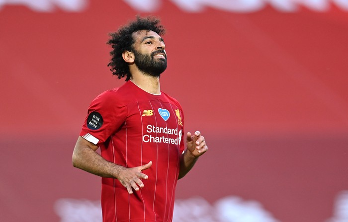 LIVERPOOL, ENGLAND - JUNE 24: Mohamed Salah of Liverpool celebrates after scoring his teams second goal during the Premier League match between Liverpool FC and Crystal Palace at Anfield on June 24, 2020 in Liverpool, England. (Photo by Paul Ellis/Pool via Getty Images)