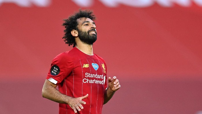 LIVERPOOL, ENGLAND - JUNE 24: Mohamed Salah of Liverpool celebrates after scoring his teams second goal during the Premier League match between Liverpool FC and Crystal Palace at Anfield on June 24, 2020 in Liverpool, England. (Photo by Paul Ellis/Pool via Getty Images)