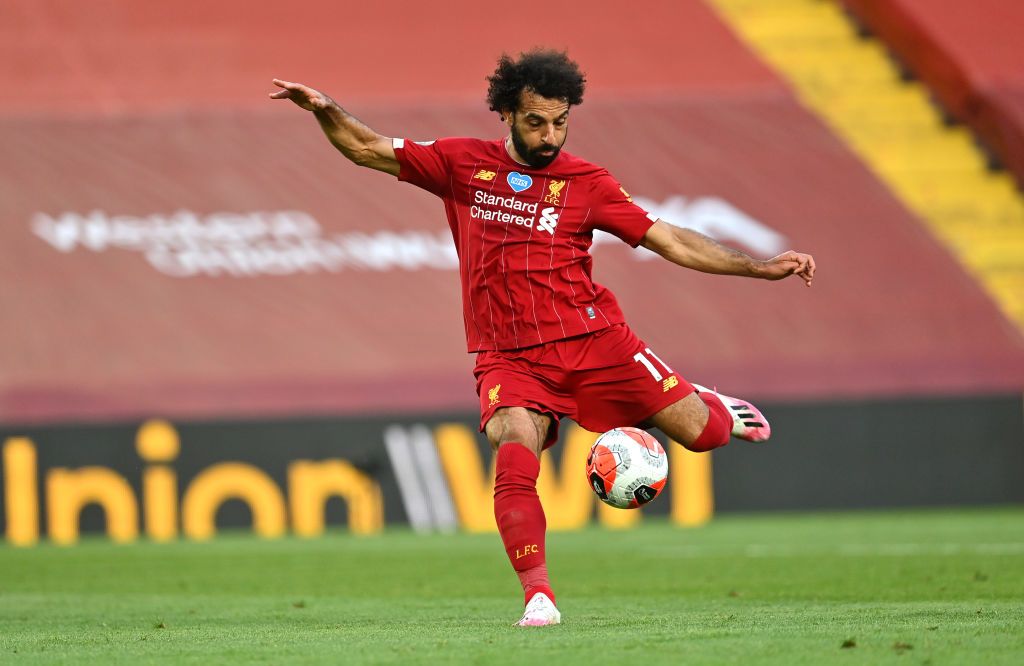 LIVERPOOL, ENGLAND - JUNE 24: Mohamed Salah of Liverpool scores his sides second goal during the Premier League match between Liverpool FC and Crystal Palace at Anfield on June 24, 2020 in Liverpool, England. (Photo by Paul Ellis/Pool via Getty Images)