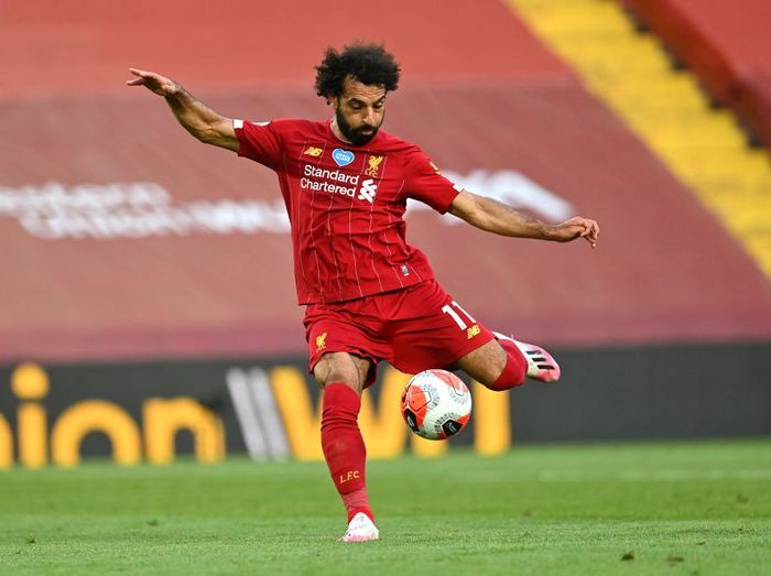 LIVERPOOL, ENGLAND - JUNE 24: Mohamed Salah of Liverpool scores his sides second goal during the Premier League match between Liverpool FC and Crystal Palace at Anfield on June 24, 2020 in Liverpool, England. (Photo by Paul Ellis/Pool via Getty Images)