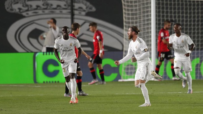 Real Madrids Sergio Ramos celebrates after scoring his sides second goal during the Spanish La Liga soccer match between Real Madrid and Mallorca at Alfredo di Stefano stadium in Madrid, Spain, Wednesday, June 24, 2020. (AP Photo/Bernat Armangue)