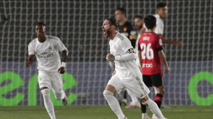 Real Madrids Sergio Ramos celebrates after scoring his sides second goal during the Spanish La Liga soccer match between Real Madrid and Mallorca at Alfredo di Stefano stadium in Madrid, Spain, Wednesday, June 24, 2020. (AP Photo/Bernat Armangue)